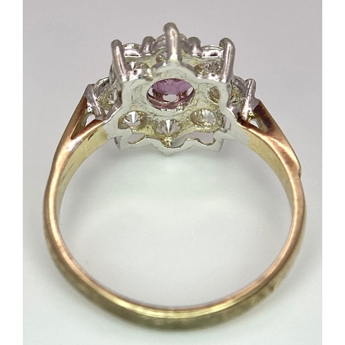 369 - AN ATTRACTIVE 9K YELLOW GOLD STONE SET CLUSTER RING IN FLORAL DESIGN, WEIGHT 1.9G SIZE J