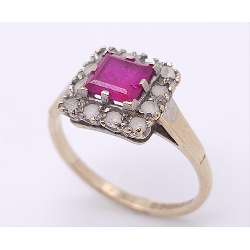 387 - A vintage 9 K yellow gold ring with a square emerald cut ruby surrounded by a halo of white sapphire... 