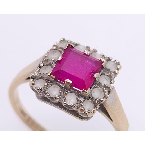 387 - A vintage 9 K yellow gold ring with a square emerald cut ruby surrounded by a halo of white sapphire... 