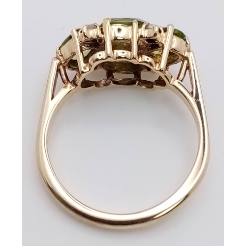 505 - A vintage 9 K yellow gold ring with four oval cut peridots and seed pearls, size: K1/2, weight: 3 g.