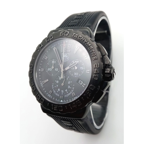 53 - A Tag Heuer Formula 1 Chronograph Gents Quartz Watch. Black Tag rubber strap. Black dial with three ... 