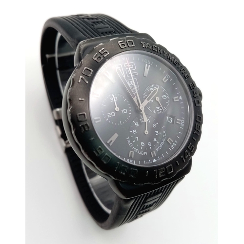 53 - A Tag Heuer Formula 1 Chronograph Gents Quartz Watch. Black Tag rubber strap. Black dial with three ... 