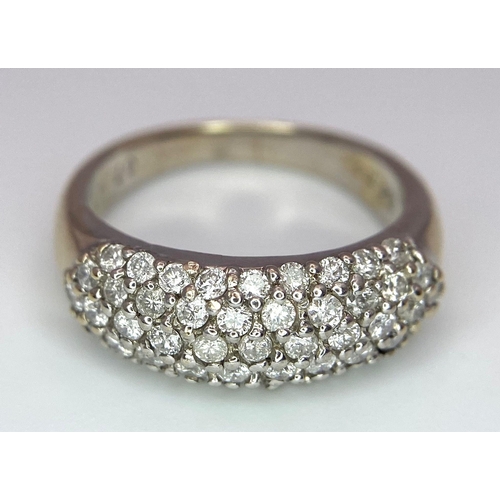 83 - An 18 K white gold ring with five round cut diamond bands (0.80 carats). Size: J, weight: 4.4 g.