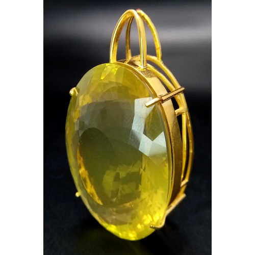 1565 - An Oval Shape Brazilian Lemon Quartz Pendant set in Gold Plated 925 Silver. Weight - 34.50g. Lemon Q... 