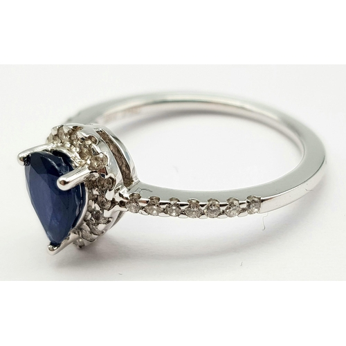 173 - An 18K White Gold, Diamond and Sapphire Pear-Shaped Cluster Ring. 0.65ct sapphire. Size M 1/2. 3.1g ... 