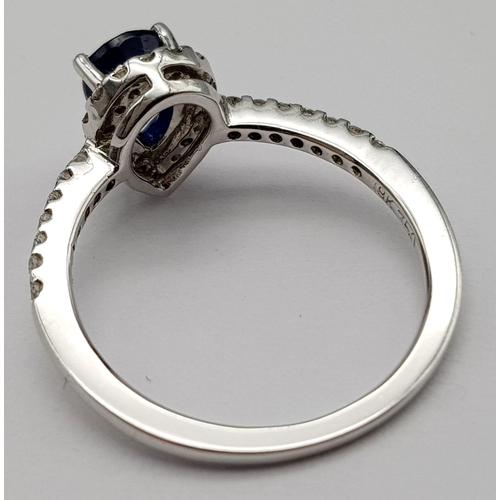 173 - An 18K White Gold, Diamond and Sapphire Pear-Shaped Cluster Ring. 0.65ct sapphire. Size M 1/2. 3.1g ... 