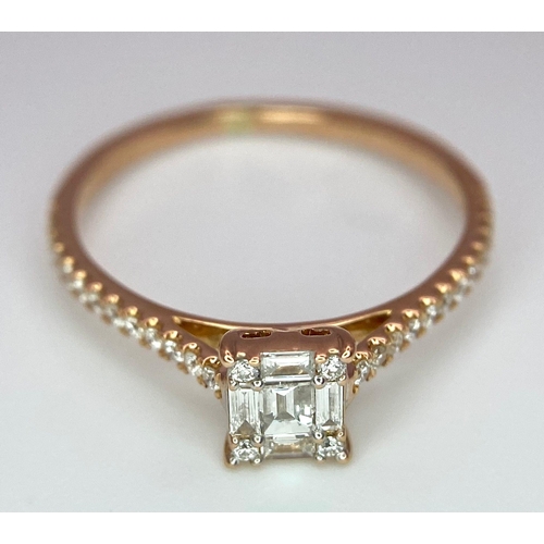 178 - An 18 K rose gold ring with a square emerald cut diamond and more round cut diamonds on the shoulder... 