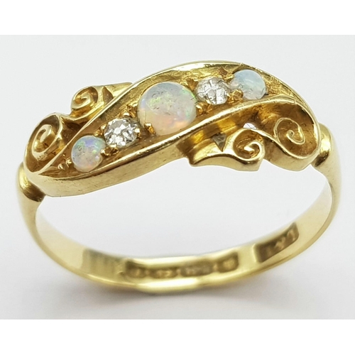 192 - An antique, 18 K yellow gold ring with two round cut diamonds between three wonderful round opal cab... 