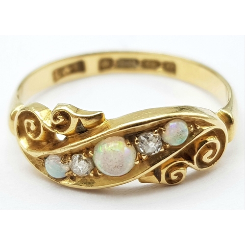 192 - An antique, 18 K yellow gold ring with two round cut diamonds between three wonderful round opal cab... 