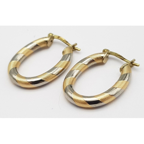 376 - A PRETTY PAIR OF 9K 2 COLOUR  GOLD OVAL HOOP EARRINGS, WEIGHT 2.1G