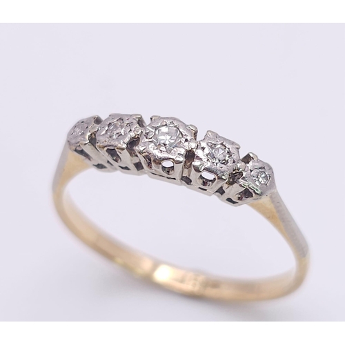 267 - An 18 K yellow gold ring with a band of five diamonds, size: S, weight: 2.4 g.