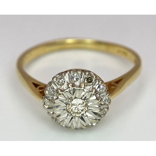 274 - An 18 K yellow gold ring with a diamond cluster, size: P, weight: 3 g.