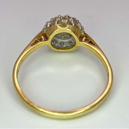 274 - An 18 K yellow gold ring with a diamond cluster, size: P, weight: 3 g.