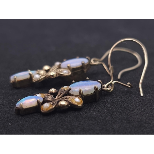 533 - A vintage, 9 K yellow gold pair of drop earrings with opals and seed pearls. height: 24 mm, weight: ... 