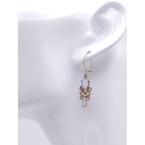 533 - A vintage, 9 K yellow gold pair of drop earrings with opals and seed pearls. height: 24 mm, weight: ... 