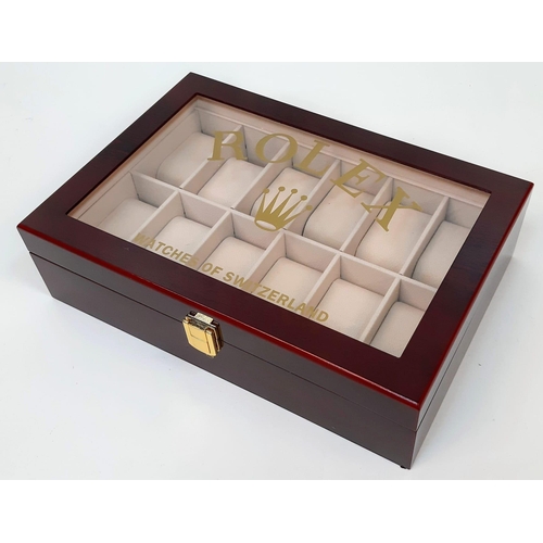 733 - An Unused  Dealers 12 Watch Display Case. 31.5x21.5x8.5cm. Rich Piano Finish Cherry Wood. Marked wit... 