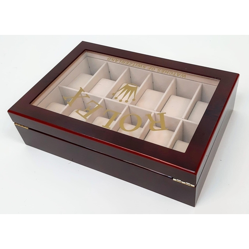 733 - An Unused  Dealers 12 Watch Display Case. 31.5x21.5x8.5cm. Rich Piano Finish Cherry Wood. Marked wit... 