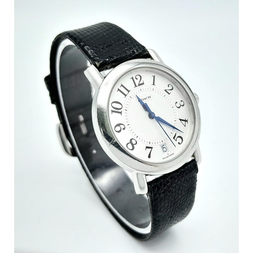 529 - A Coach Quartz Gents Watch. Black leather strap. Stainless steel case. White dial. In working order.