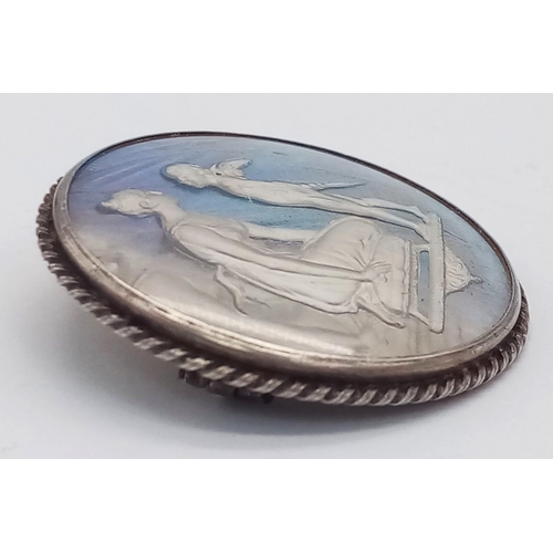 550 - An Art Deco Silver Butterfly Wing Brooch. Mother and child-cherub decoration. 3.5cm diameter. Ref: 1... 