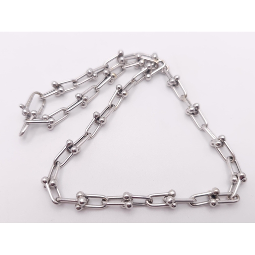 67 - A Tiffany and Co. 18K White Elongated Link Necklace. Tiffany markings on clasp. 42cm length. 17.05g ... 