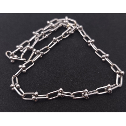 67 - A Tiffany and Co. 18K White Elongated Link Necklace. Tiffany markings on clasp. 42cm length. 17.05g ... 