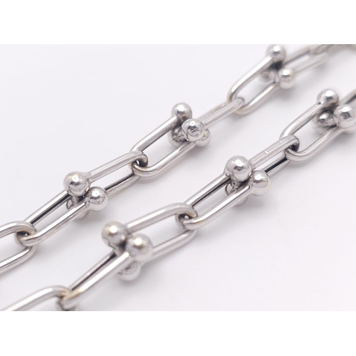 67 - A Tiffany and Co. 18K White Elongated Link Necklace. Tiffany markings on clasp. 42cm length. 17.05g ... 