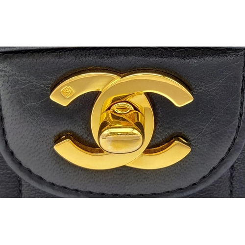 1 - An Early 1990s Chanel Mademoiselle Classic Flap Chain Bag. Black lambskin leather. Gold plated hardw... 