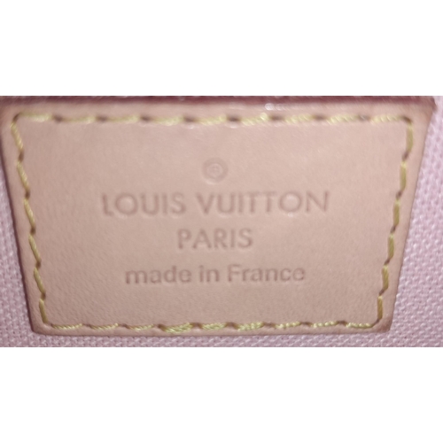 123 - A Louis Vuitton damier canvas Croisette handbag in cream/blue, interior is baby pink. Leather handle... 