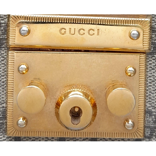 15 - A Gucci GG padlock medium shoulder bag, gold tone hardware, brown suede leather interior. Size appro... 