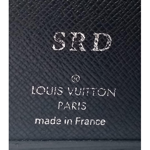 172 - A Louis Vuitton black cowhide leather wallet. Engraved with initials SRD. Size approx. 11x11cm. Come... 