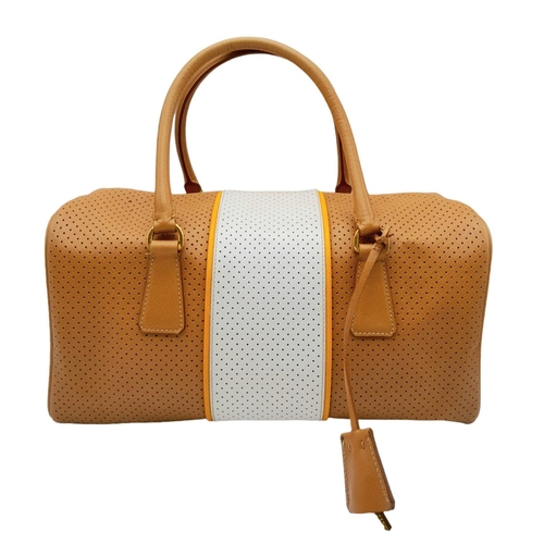 179 - A Prada beige/white perforated leather Bauletto satchel. Gold tone hardware, feet to base, no should... 