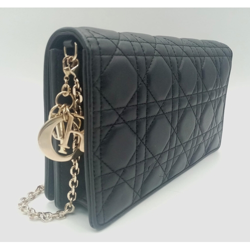 193 - A Lady Dior pouch bag in black lambskin, gold tone hardware to include a removable chain shoulder st... 