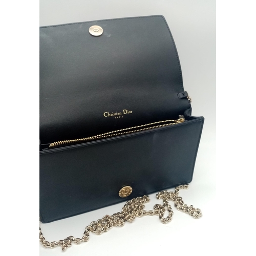 193 - A Lady Dior pouch bag in black lambskin, gold tone hardware to include a removable chain shoulder st... 