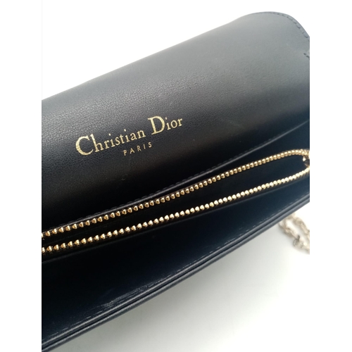 193 - A Lady Dior pouch bag in black lambskin, gold tone hardware to include a removable chain shoulder st... 