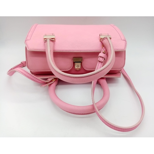 298 - A Victoria Beckham two toned candy pink textured leather mini bag, patent leather trim with gold har... 