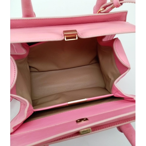 298 - A Victoria Beckham two toned candy pink textured leather mini bag, patent leather trim with gold har... 