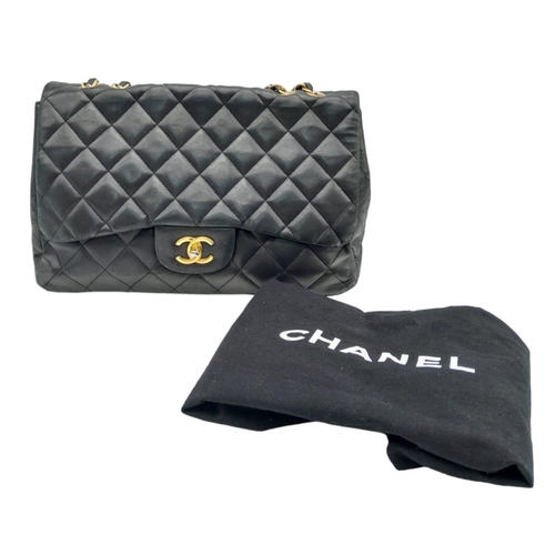 36 - A Chanel Black Caviar Classic Single Flap Bag. Quilted pebbled leather exterior with gold-toned hard... 