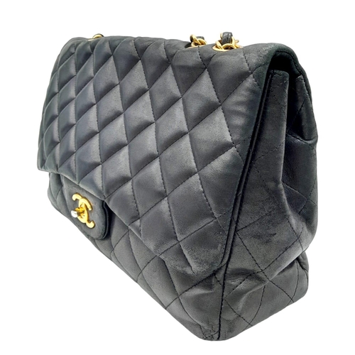 36 - A Chanel Black Caviar Classic Single Flap Bag. Quilted pebbled leather exterior with gold-toned hard... 