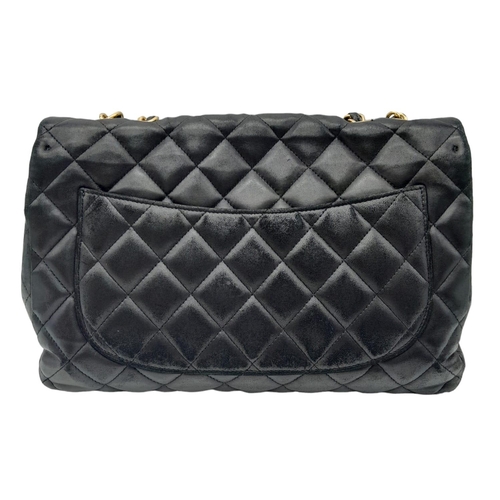 36 - A Chanel Black Caviar Classic Single Flap Bag. Quilted pebbled leather exterior with gold-toned hard... 