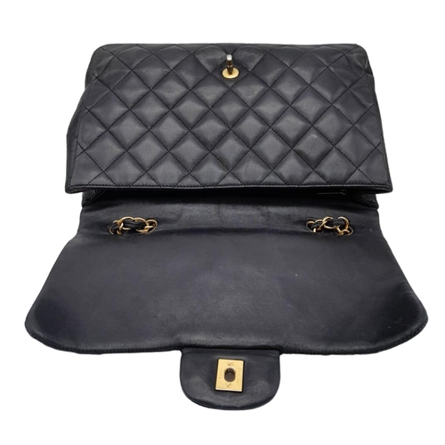 36 - A Chanel Black Caviar Classic Single Flap Bag. Quilted pebbled leather exterior with gold-toned hard... 