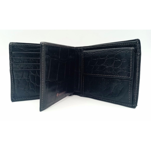 452 - A black leather Mulberry wallet, can hold up to 8 cards, includes a coin pouch. Size approx. 11x9cm.... 