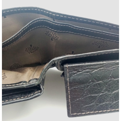 452 - A black leather Mulberry wallet, can hold up to 8 cards, includes a coin pouch. Size approx. 11x9cm.... 