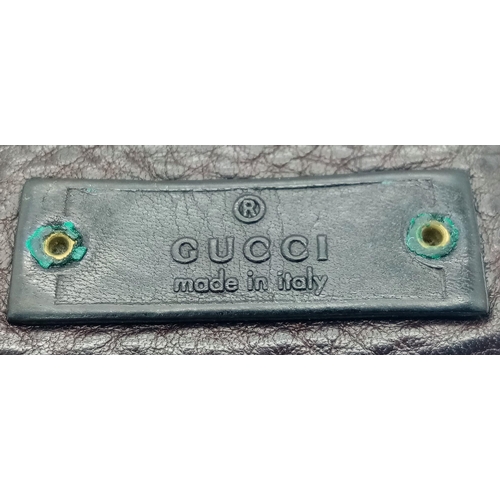 494 - A dark brown leather Gucci card wallet, 3 card holders with a popper pocket. Size approx. 11x9x2cm. ... 