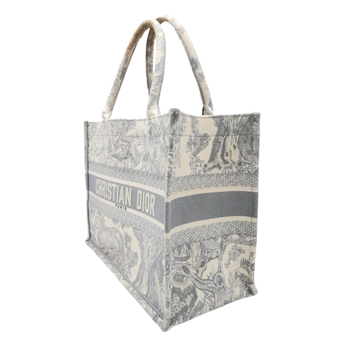 59 - A Christian Dior small toile de jouy book tote bag, grey/white embroidery, top handles. Size approx.... 