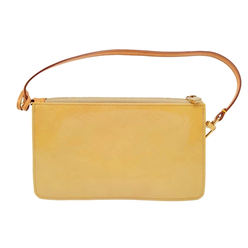 93 - A Louis Vuitton lime yellow Lexington pouch bag, patent leather exterior, beige interior, gold tone ... 