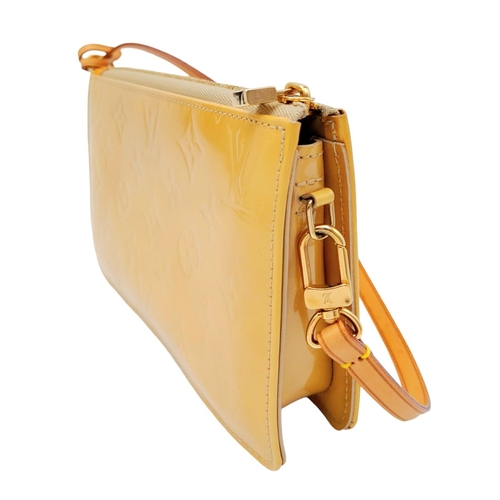 93 - A Louis Vuitton lime yellow Lexington pouch bag, patent leather exterior, beige interior, gold tone ... 