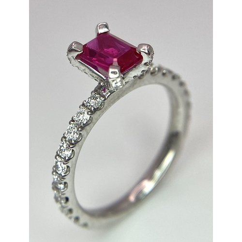 171 - A very elegant platinum ring with an emerald cut ruby and diamonds (0.60 carats) on the crown and th... 