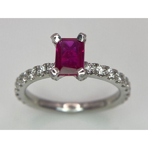 171 - A very elegant platinum ring with an emerald cut ruby and diamonds (0.60 carats) on the crown and th... 