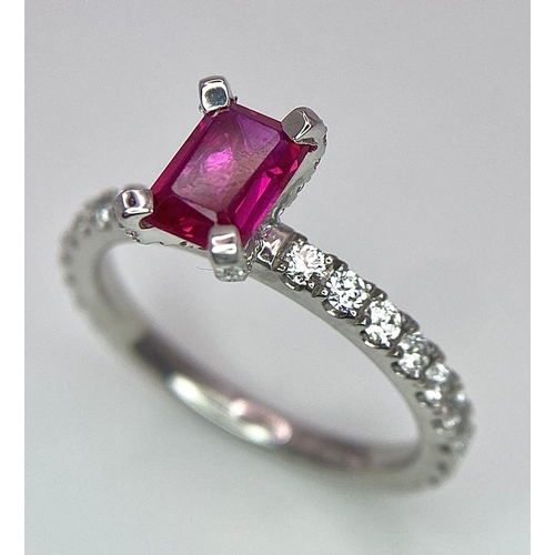 171 - A very elegant platinum ring with an emerald cut ruby and diamonds (0.60 carats) on the crown and th... 