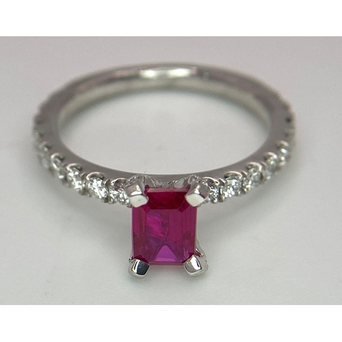 171 - A very elegant platinum ring with an emerald cut ruby and diamonds (0.60 carats) on the crown and th... 